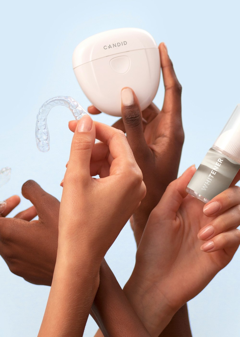 Clear aligner held by the hygienist